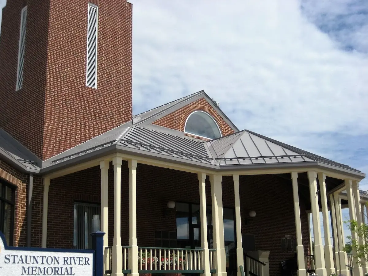 Skilled roofing craftsmen working on a residential roof in Ravenel